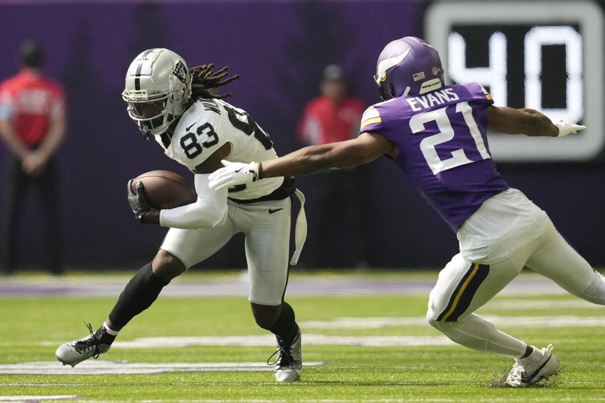 Las Vegas Raiders wide receiver Kristian Wilkerson (83) makes a catch in front of Minnesota Vik ...