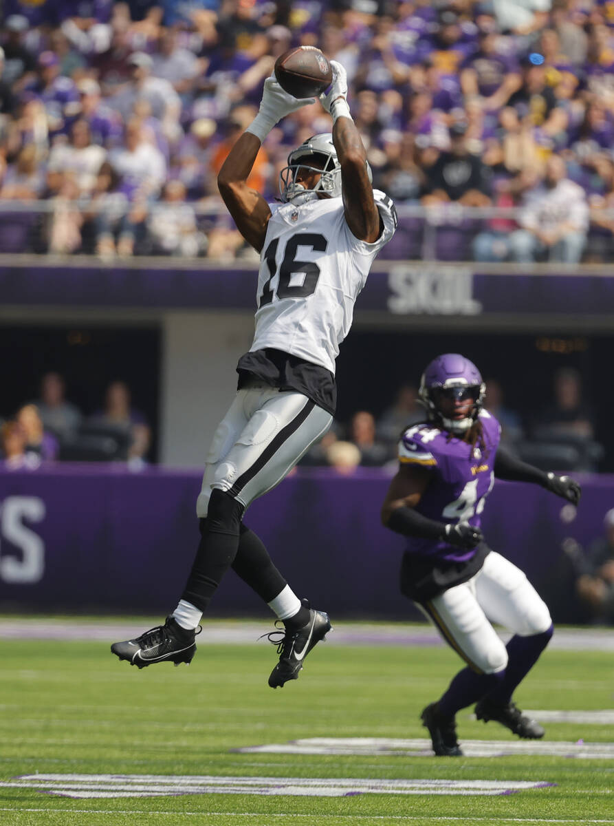 Las Vegas Raiders wide receiver Jakobi Meyers (16) pulls down a catch in front of Minnesota Vik ...