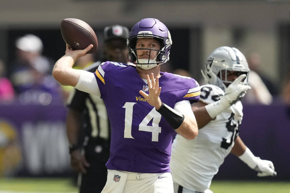 Minnesota Vikings quarterback Sam Darnold (14) throws against the Las Vegas Raiders during the ...