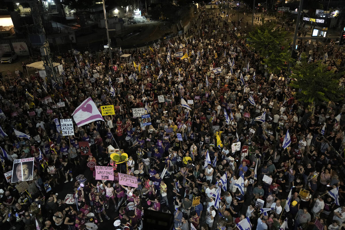 People protest against Israeli Prime Minister Benjamin Netanyahu's government and call for the ...