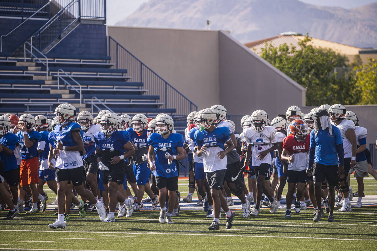 Bishop Gorman football players head off the field at the end of practice on Thursday, Aug. 8, 2 ...