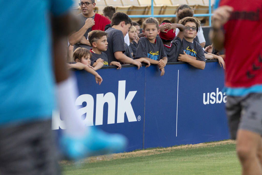 Young Las Vegas Lights FC fans watch the team warmup before a USL Championship soccer game agai ...