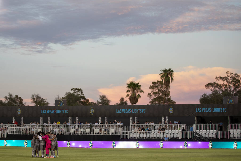 Members of the Las Vegas Lights FC huddle before a USL Championship soccer game against the Det ...