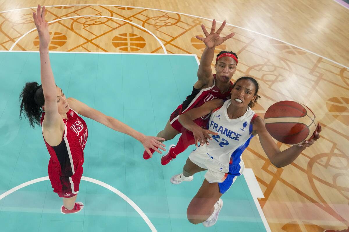 Marieme Badiane, right, (22), of France, shoots for a basket as United States' Breanna Stewart, ...