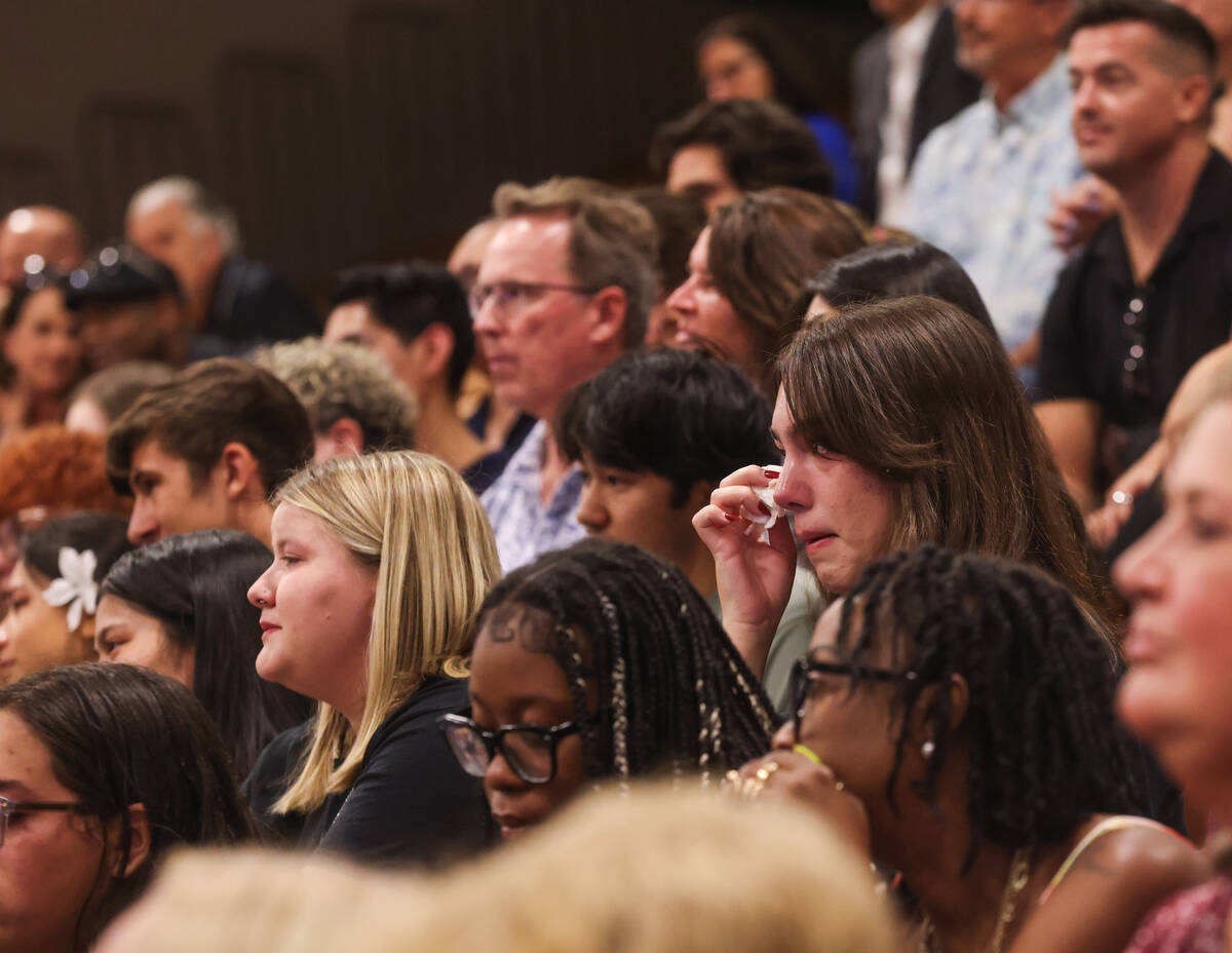 Students tear up during a memorial service for Eric Johnston, a former teacher and basketball c ...