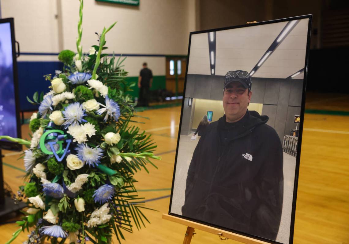 A photo of Eric Johnston, a former teacher and basketball coach who died in late July, at his m ...