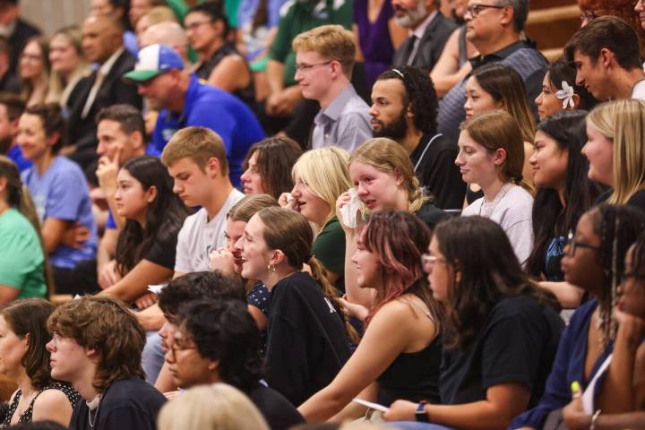 Students tear up during a memorial service for Eric Johnston, a former teacher and basketball c ...