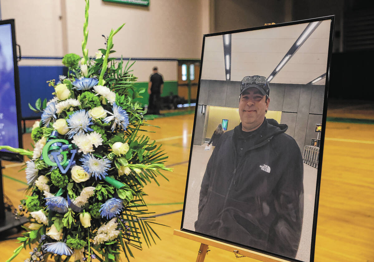 A photo of Eric Johnston, a former teacher and basketball coach who died in late July, at his m ...