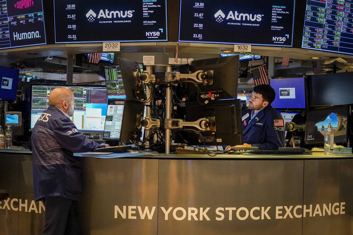 Traders work at their stations at the New York Stock Exchange, Friday, May 26, 2023, in New Yor ...