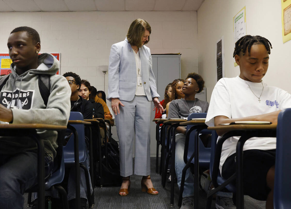 Interim Superintendent Brenda Larsen-Mitchell talks to 11th grade students as she visits Legacy ...