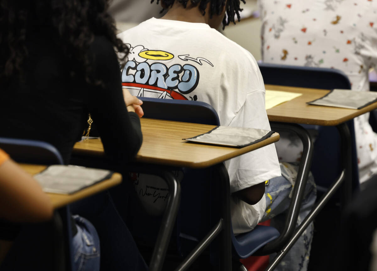 Cellphone pouches are displayed on Legacy High School students' desks during the first day of s ...