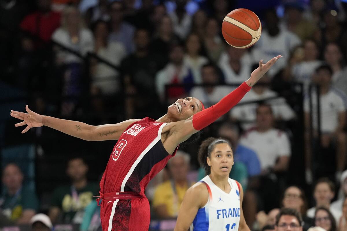 United States' A'ja Wilson (9) grabs a loose ball in front of Janelle Salaun (13), of France, d ...