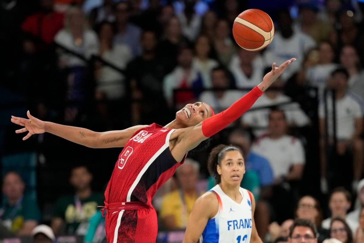 United States' A'ja Wilson (9) grabs a loose ball in front of Janelle Salaun (13), of France, d ...