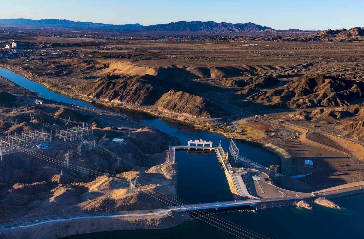 The sun rises on Davis Dam and beyond along the Colorado River on Jan. 28, 2023, north of Laugh ...