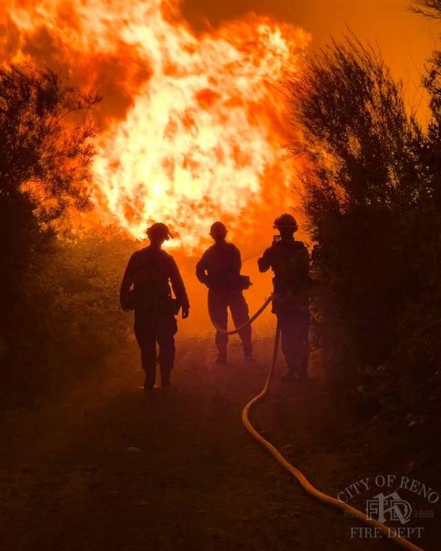 Firefighters work to contain the Gold Ranch Fire, burning near the town of Verdi in Washoe Coun ...