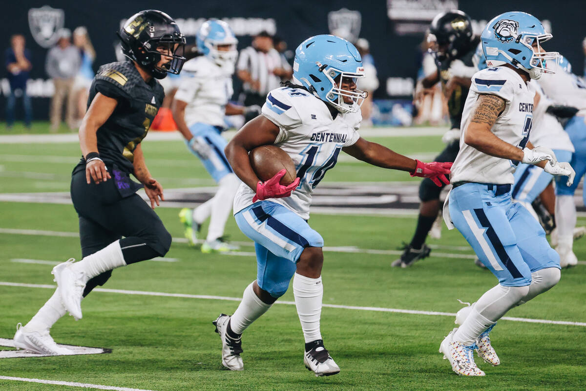 Centennial running back Khyren Harris (14) runs the ball during a class 4A state championship g ...