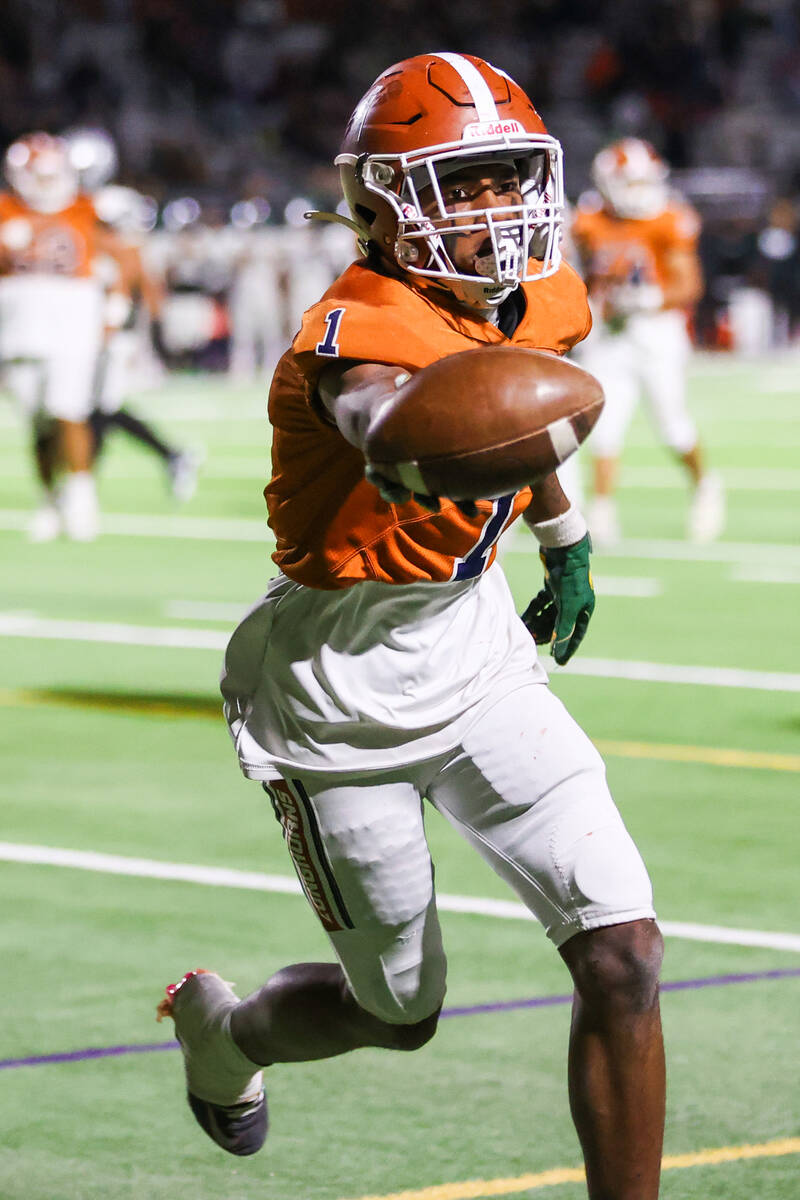 Legacy’s Dominic Oliver (1) celebrates making a touchdown during the Class 5A Division I ...