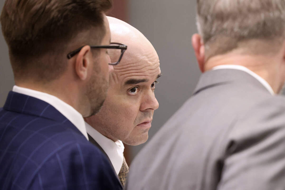 Robert Telles, center, listens in court with his attorneys Robert Draskovich, right, and Michae ...