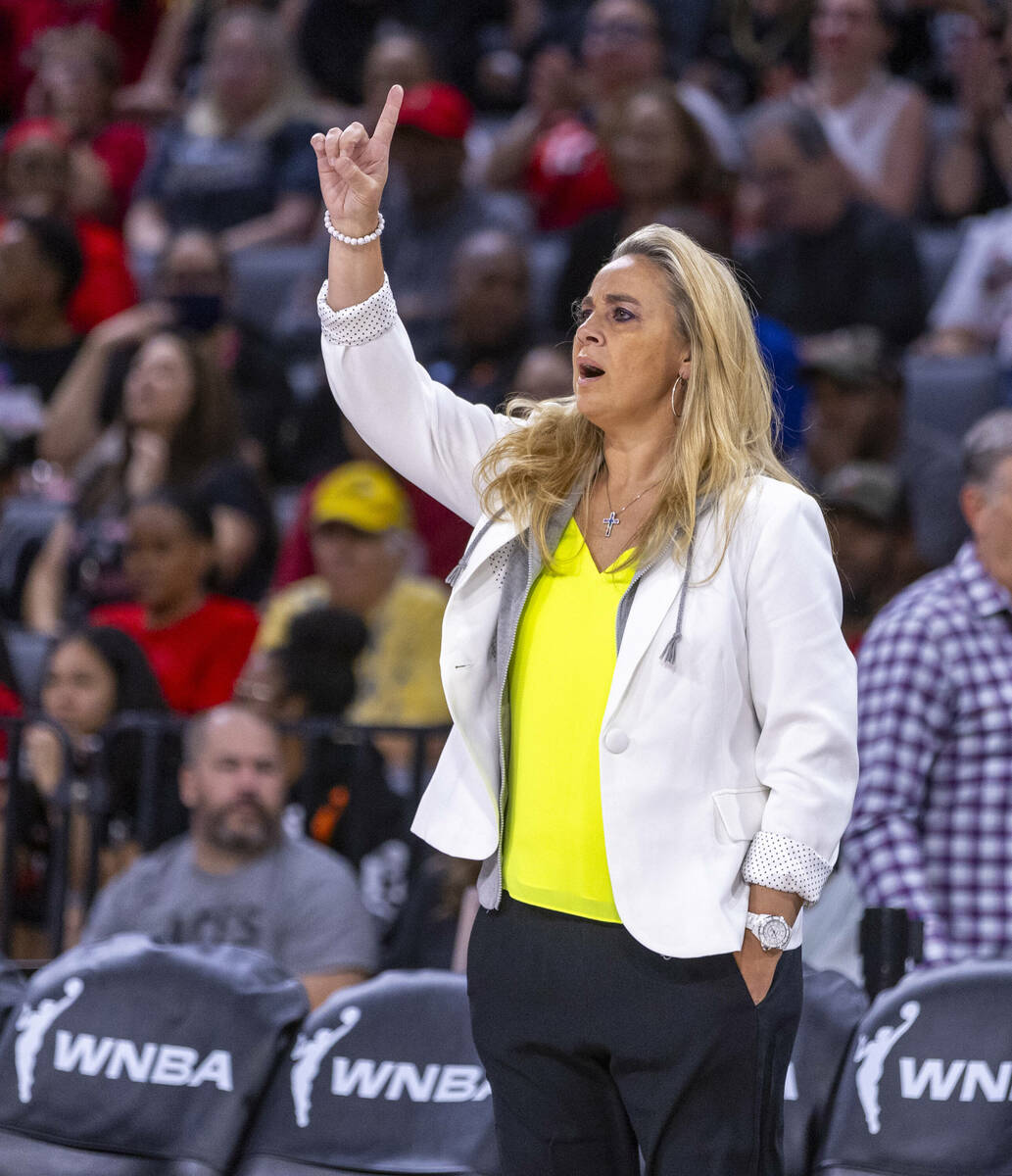 Aces head coach Becky Hammon signals to her players against the Phoenix Mercury during the ...