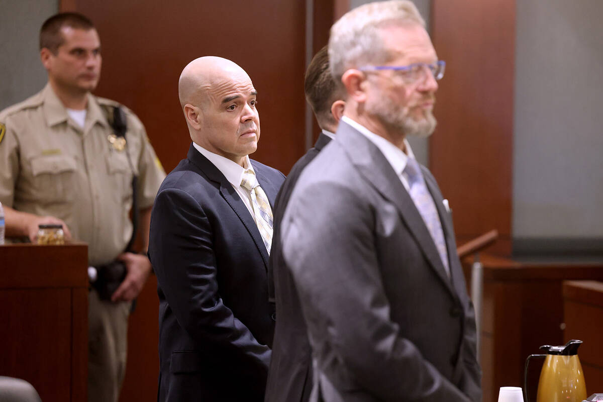 Robert Telles, left, watches as the jury walks into the courtroom on the third day of his murde ...