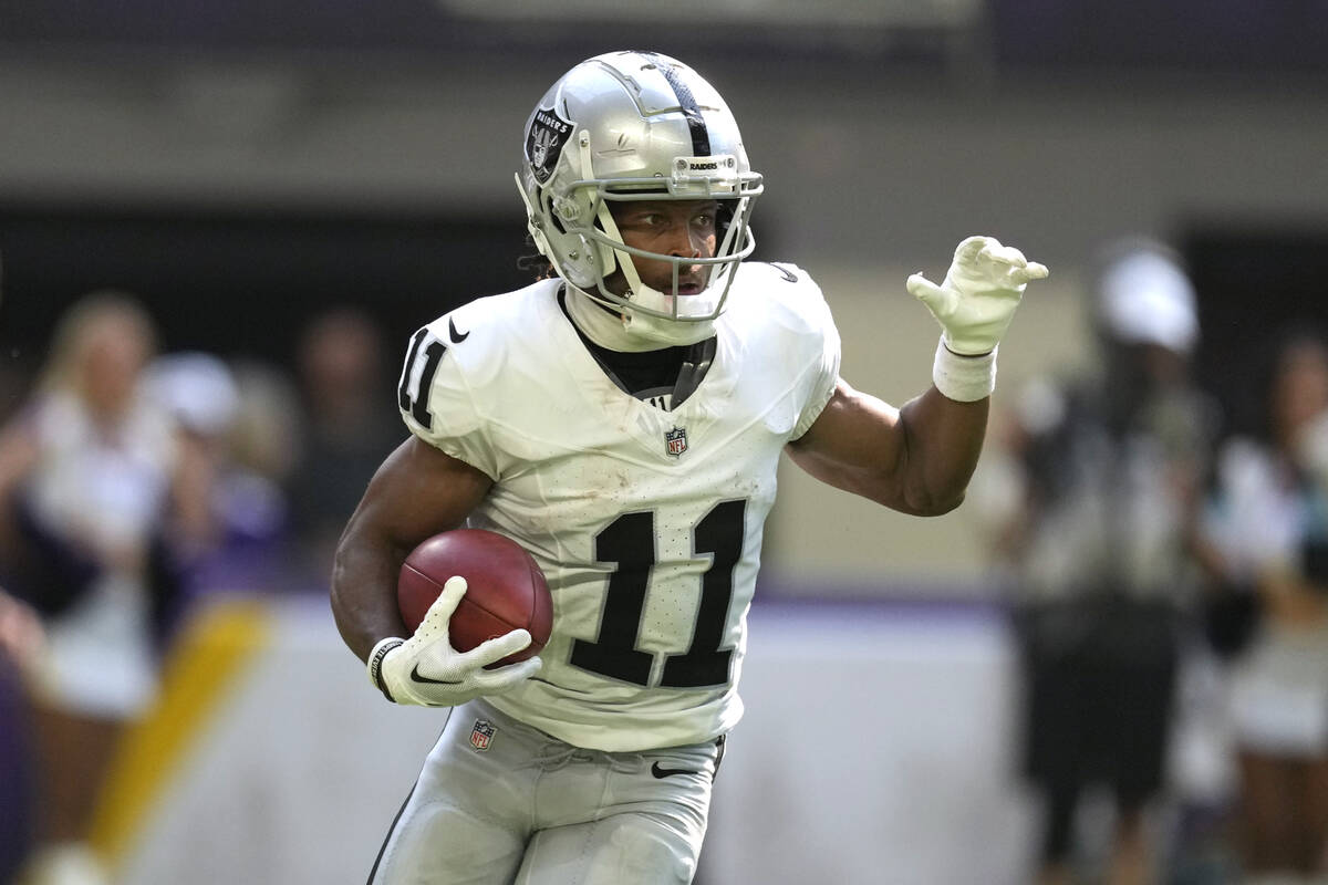 Las Vegas Raiders wide receiver Tre Tucker (11) returns a punt during the first half of an NFL ...