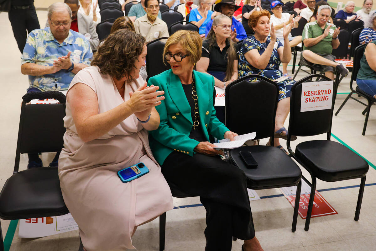 Rep. Katie Porter, D-Calif., left, speaks to Rep. Susie Lee, D-Nev., during a small rally hoste ...