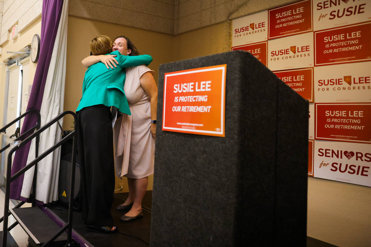 Rep. Katie Porter, D-Calif., facing, hugs Rep. Susie Lee, D-Nev., after introducing her during ...