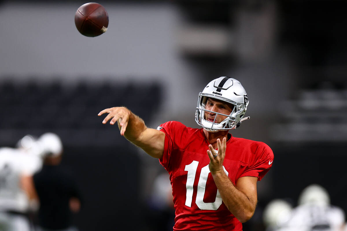 Raiders quarterback Nathan Peterman (10) throws the ball during an NFL football practice at All ...