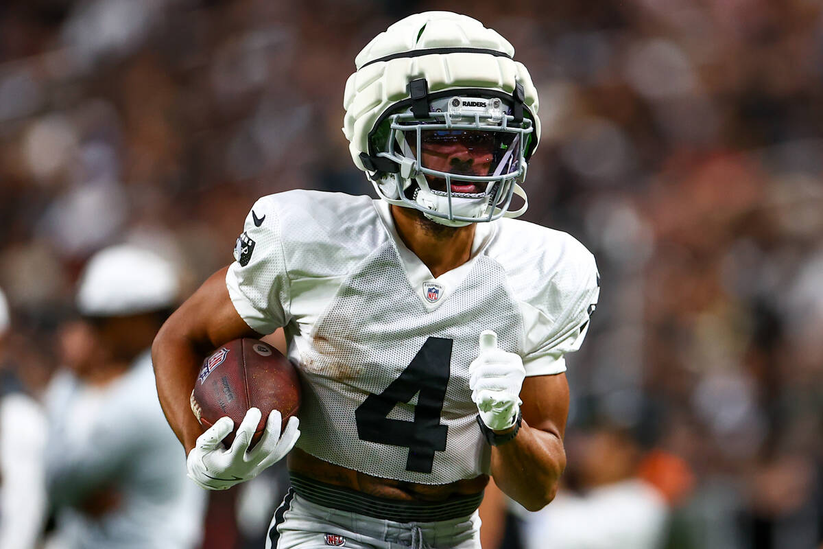 Raiders wide receiver Jalen Guyton (4) carries the ball up the field during an NFL football pra ...