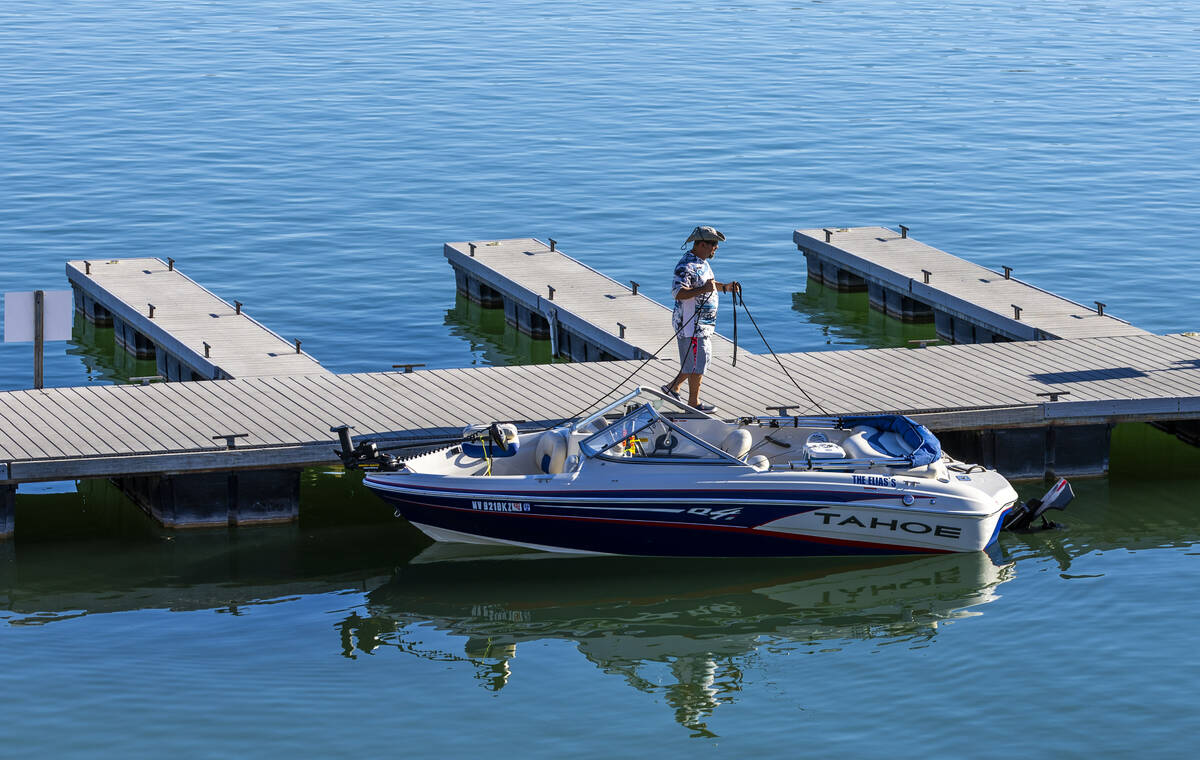 A boater waits to shove off after launching at the Callville Bay Marina on Lake Mead Thursday, ...