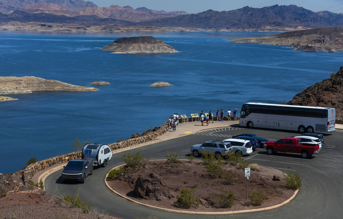 A tour bus drops off passengers to view Lake Mead from the Lakeview Overlook on Thursday, Aug. ...