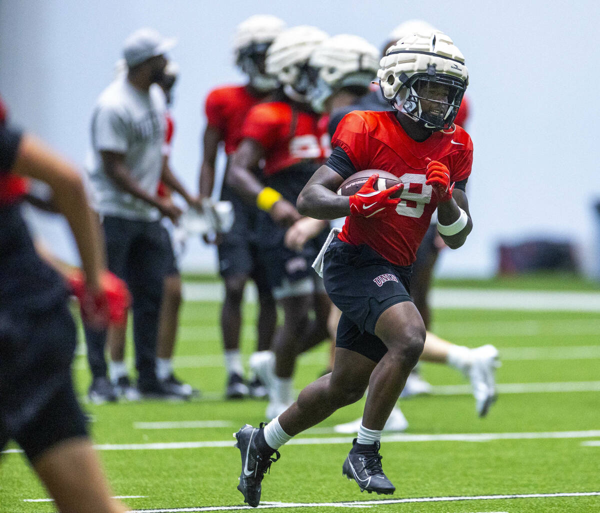 UNLV running back Jai'Den Thomas (9) runs up the field during football practice at the Intermou ...