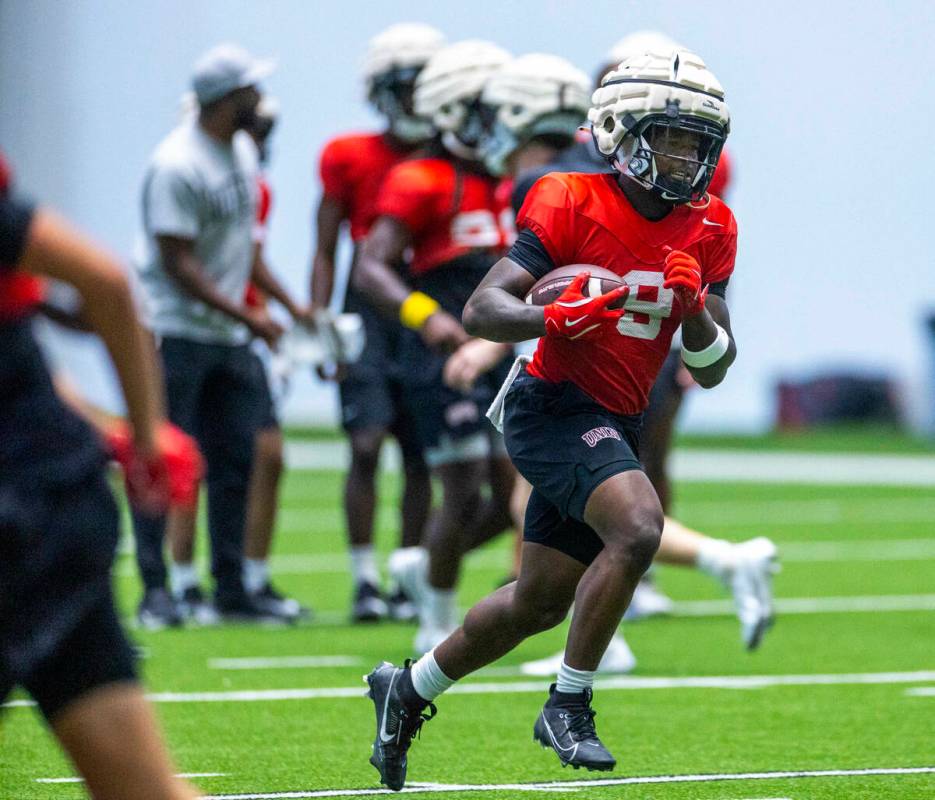 UNLV running back Jai'Den Thomas (9) runs up the field during football practice at the Intermou ...