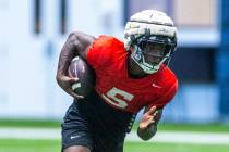 UNLV running back Greg Burrell (5) runs up the field during football practice at the Intermount ...