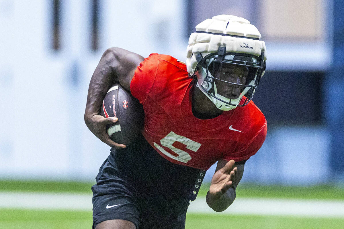 UNLV running back Greg Burrell (5) runs up the field during football practice at the Intermount ...