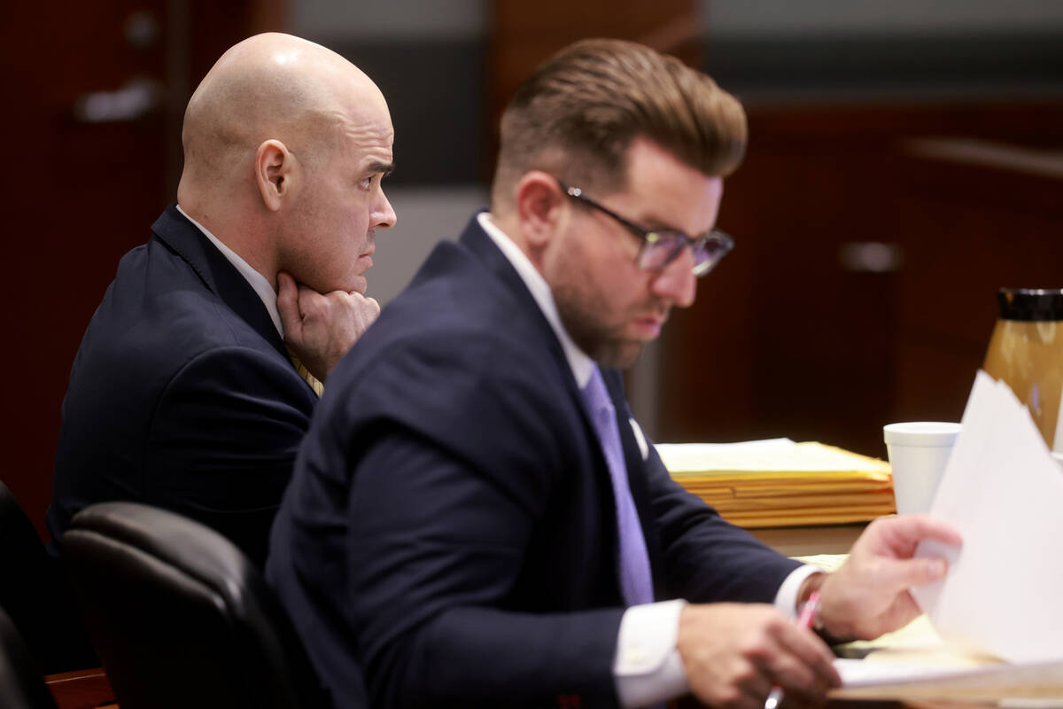 Robert Telles, left, listens to testimony with one of his attorneys, Michael Horvath, on the fo ...