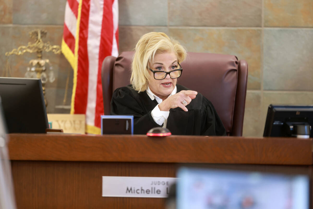 District Judge Michelle Leavitt speaks to a juror of the fourth day of the murder trial for Rob ...