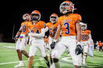 Legacy High School football players celebrate winning the Class 5A Division III Southern League ...