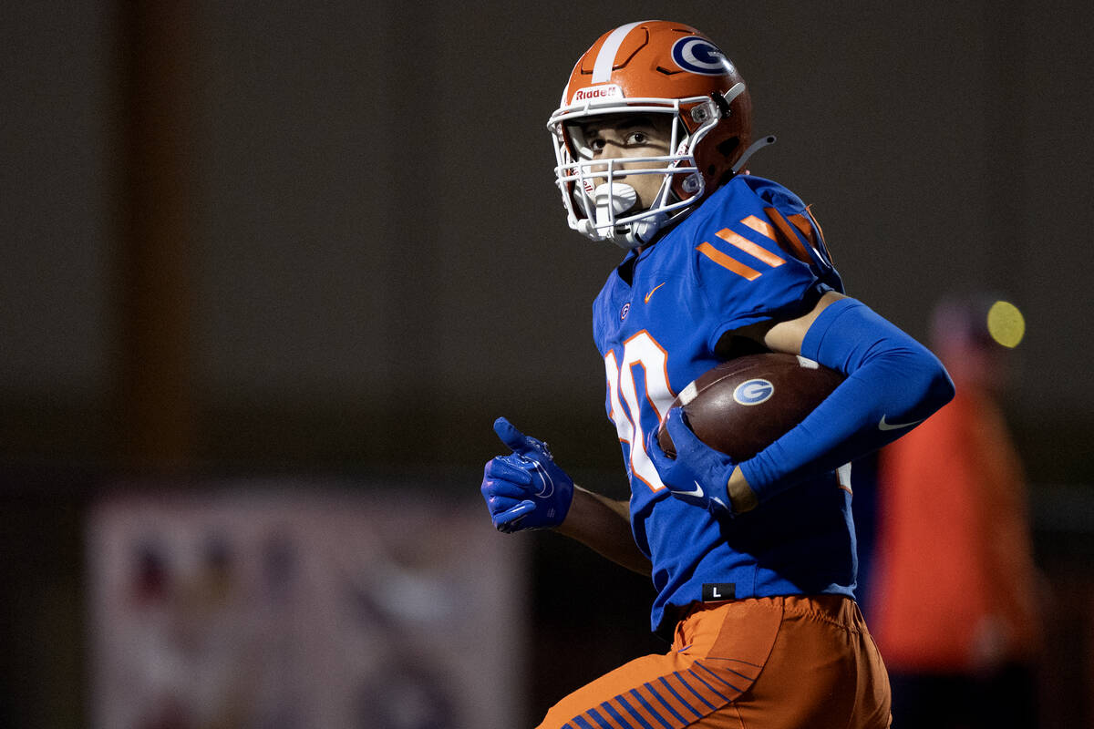 Bishop Gorman wide receiver Derek Meadows (30) runs in a touchdown during the first half of a C ...