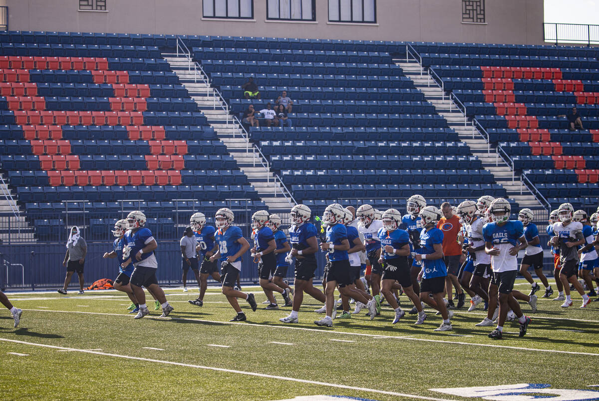 Bishop Gorman football players head off the field at the end of practice on Thursday, Aug. 8, 2 ...