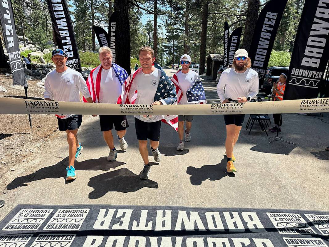 As Tyler Nash crossed the finish line, he was joined by members of his crew including, from lef ...