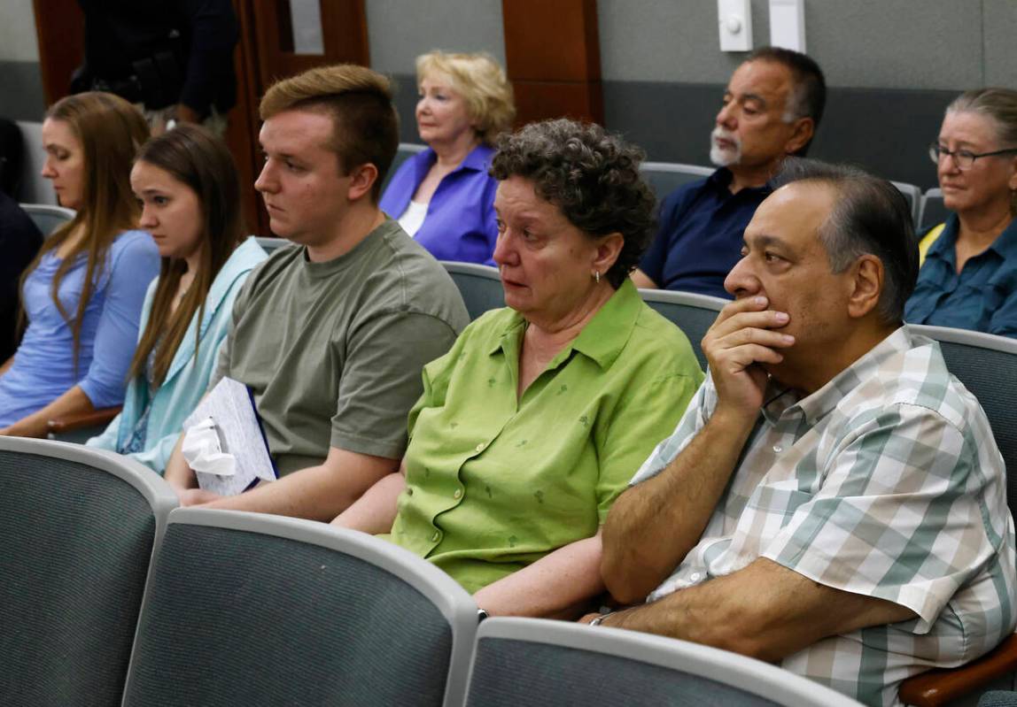 Family members of murder victim Paula Davis, including her mother Kara Davis, far left, and her ...