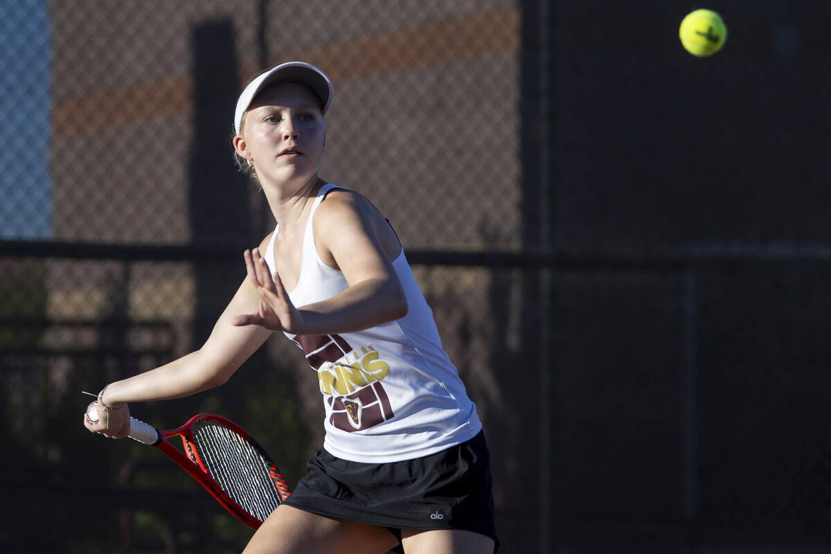 Faith Lutheran sophomore McCauley Hill competes during the tennis matches against The Meadows a ...