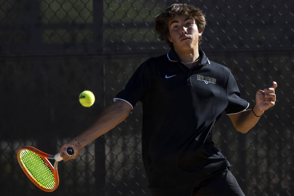 Faith Lutheran junior Beckham Butler competes during the tennis matches against The Meadows at ...