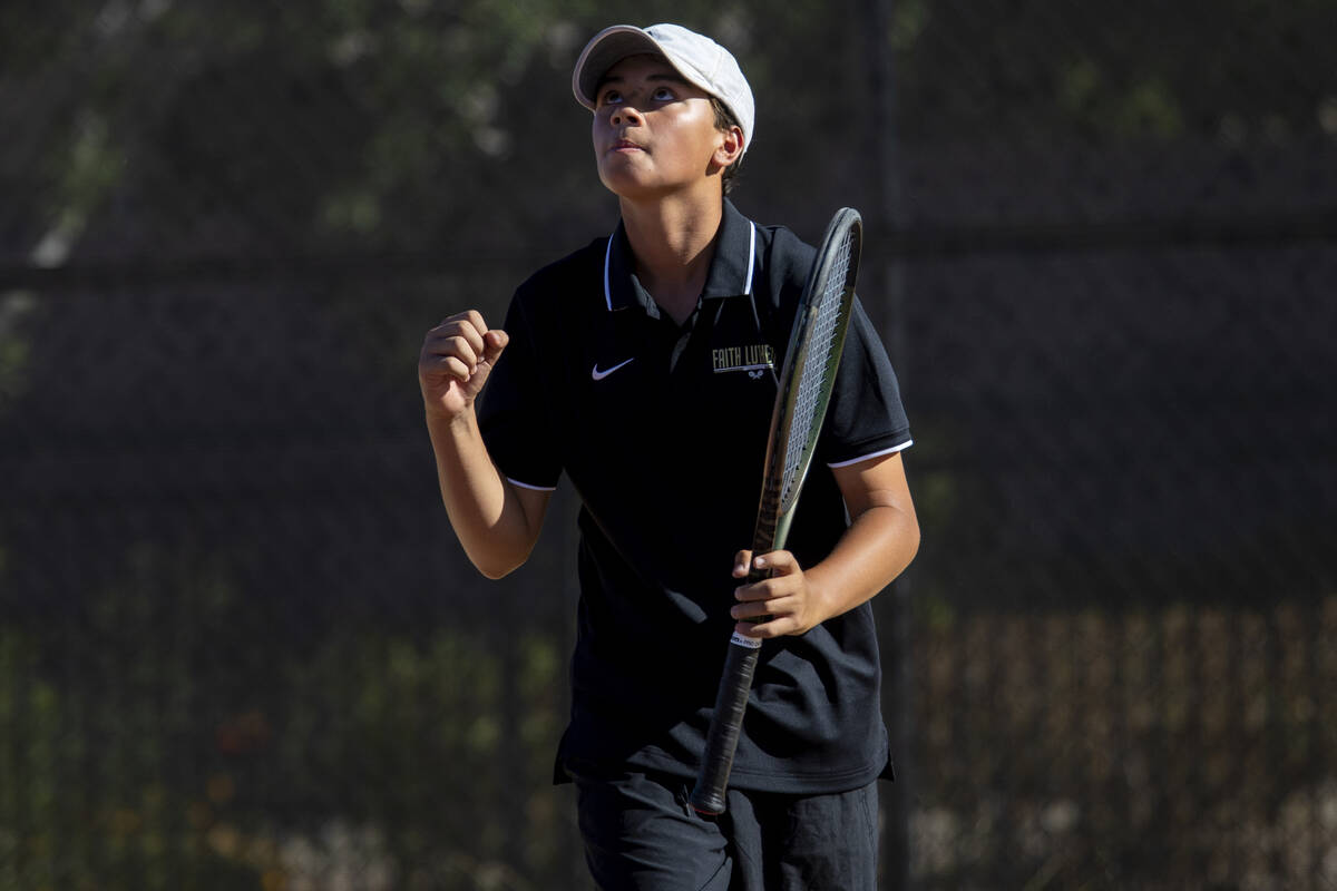 Faith Lutheran freshman Tyson Young celebrates during a tennis match against The Meadows at Fai ...