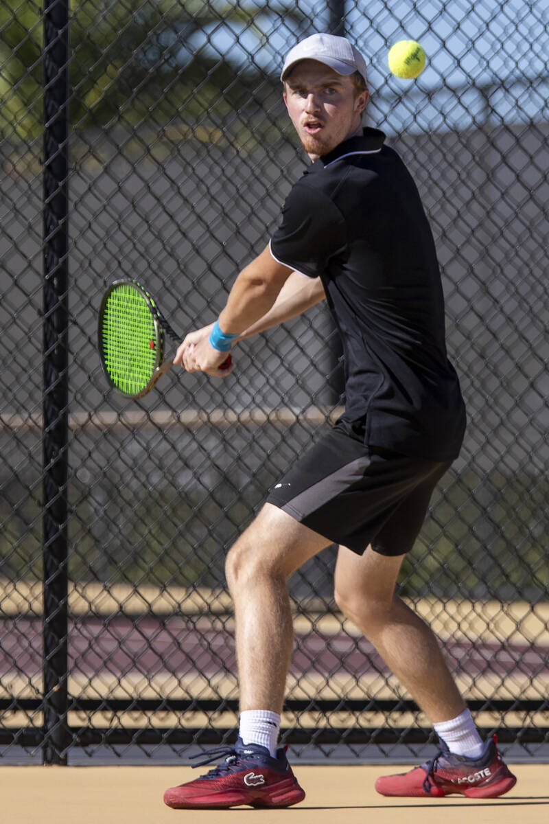 Faith Lutheran senior Nolan Dubay competes during the tennis matches against The Meadows at Fai ...