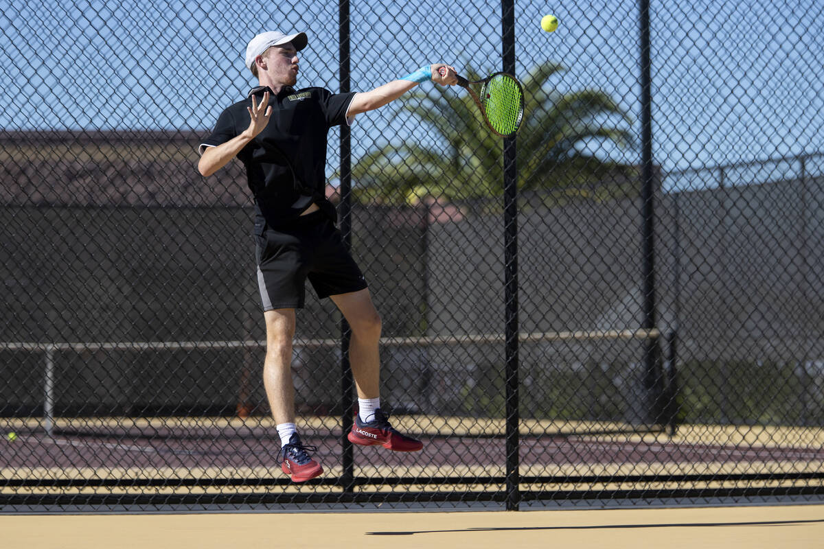 Faith Lutheran senior Nolan Dubay competes during the tennis matches against The Meadows at Fai ...