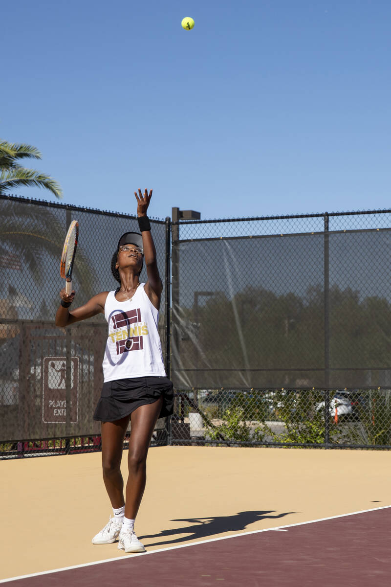 Faith Lutheran senior Taryn Toomer prepares to serve the ball during the tennis matches against ...