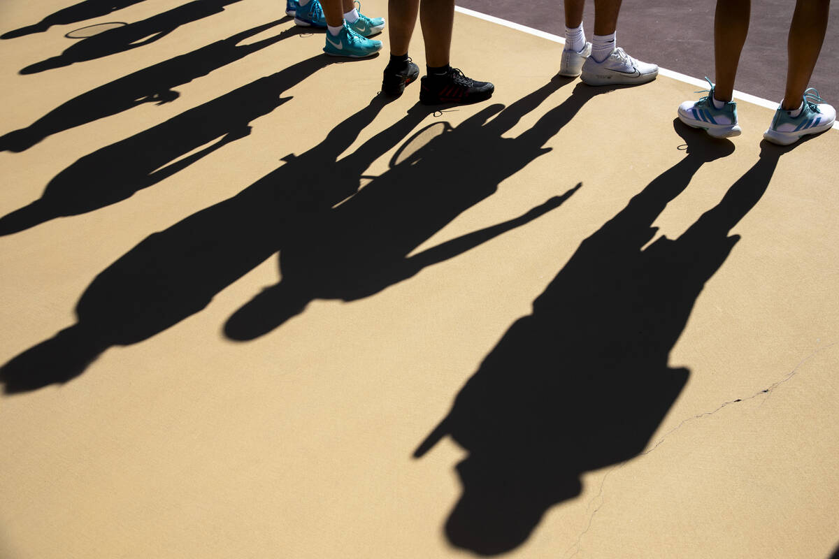 Members of The Meadows boys tennis team wait for their name to be called during the tennis matc ...