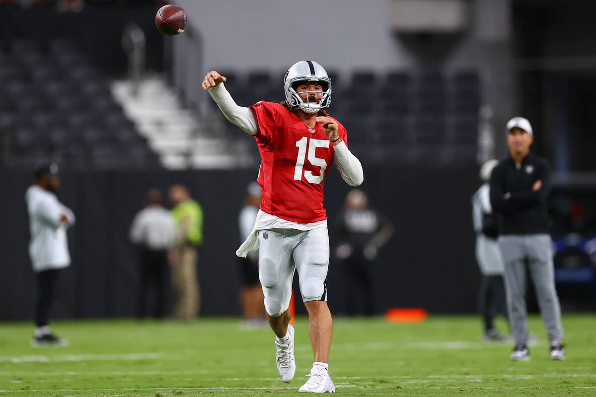 Raiders quarterback Gardner Minshew II (15) throws the ball during an NFL football practice at ...